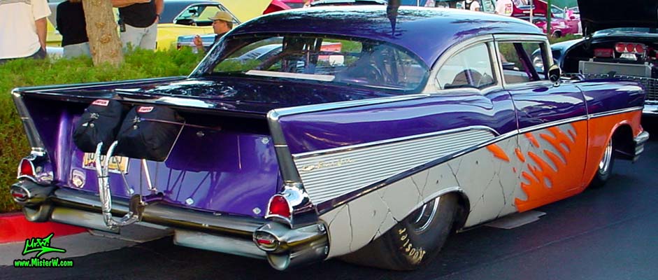 Photo of a purple 1957 Chevrolet 2 Door Hardtop Coupe Dragster Race Car at the Scottsdale Pavilions Classic Car Show in Arizona. Sideview of a 1957 Chevrolet Coupe Funny Race Car