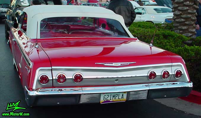 Photo of a red 1962 Chevrolet Impala Convertible at the Scottsdale Pavilions Classic Car Show in Arizona. 