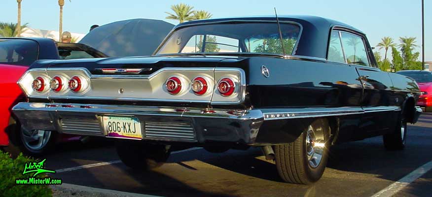 Photo of a black 1963 Chevrolet Impala 2 Door Hardtop Coupe at the Scottsdale Pavilions Classic Car Show in Arizona. 1963 Chevrolet Impala Coupe