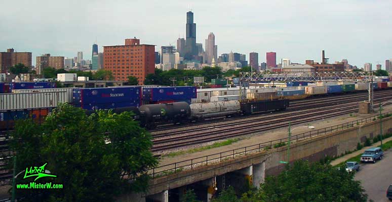 Photo of the Chicago skyline, taken from a blue line subway train close the 18th Street station in summer 2004 Freight Trains & Skyscraper Skyline of Downtown Chicago