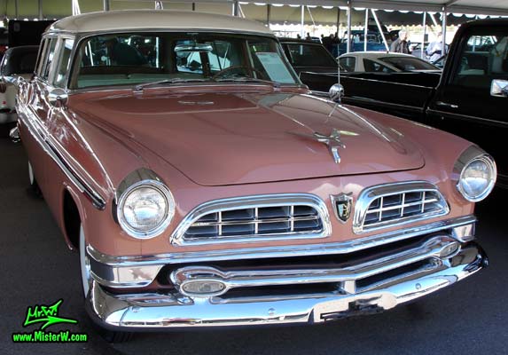 Photo of a pink & white 1955 Chrysler New Yorker Deluxe Town & Country Station Wagon at a classic car auction in Scottsdale, Arizona. Front Chrome Grill of a 55 Chrysler New Yorker Deluxe Town & Country Stationwagon