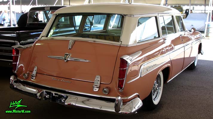 Photo of a pink & white 1955 Chrysler New Yorker Deluxe Town & Country Station Wagon at a classic car auction in Scottsdale, Arizona. 55 Chrysler New Yorker Deluxe Town & Country Stationwagon Tailfins