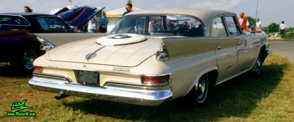Photo of a tan 1961 Chrysler 4 Door Hardtop Sedan at a classic car meeting in Germany. 1961 Chrysler Sedan Rearview