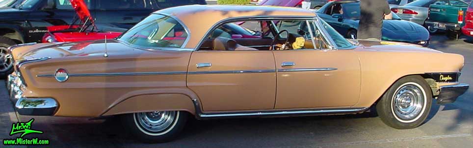 Photo of a peach rose pink 1962 Chrysler 300 4 Door Hardtop Sedan at the Scottsdale Pavilions Classic Car Show in Arizona. Sideview of a 1962 Chrysler 300 Sedan