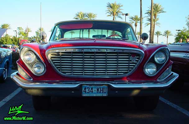 Photo of a red 1962 Chrysler 300 2 Door Hardtop Coupe at the Scottsdale Pavilions Classic Car Show in Arizona. Chrome Grill of a 1962 Chrysler 300 Coupe