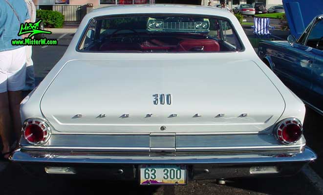 Photo of a white 1963 Chrysler 300 2 Door Hardtop Coupe at the Scottsdale Pavilions Classic Car Show in Arizona. Back of a 1963 Chrysler 300