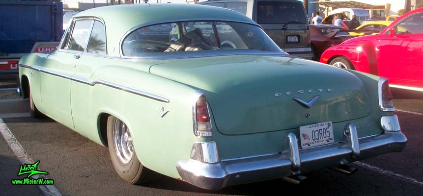 Photo of a turquoise 1955 Chrysler DeSoto Firedome 2 Door Hardtop Coupe at the Scottsdale Pavilions Classic Car Show in Arizona. Tailfins of a 55 DeSoto Firedome Coupe