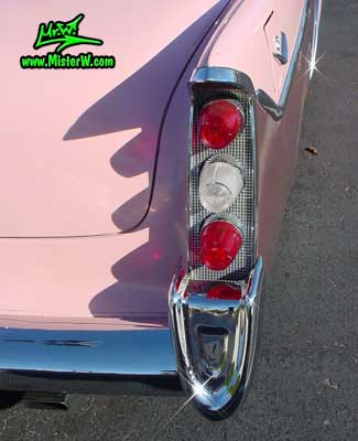 Photo of a pink 1956 Chrysler DeSoto Firedome 4 Door Hardtop Sedan at the Scottsdale Pavilions Classic Car Show in Arizona. Tail Lights of a 1956 DeSoto Firedome Sedan