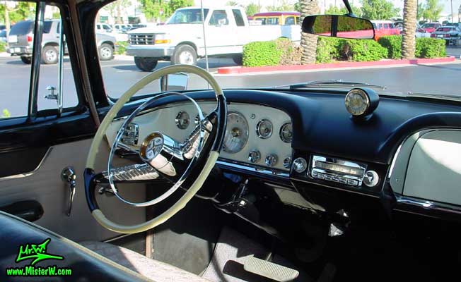 Photo of a pink 1956 Chrysler DeSoto Firedome 4 Door Hardtop Sedan at the Scottsdale Pavilions Classic Car Show in Arizona. Dashboard of a 1956 DeSoto Firedome Sedan
