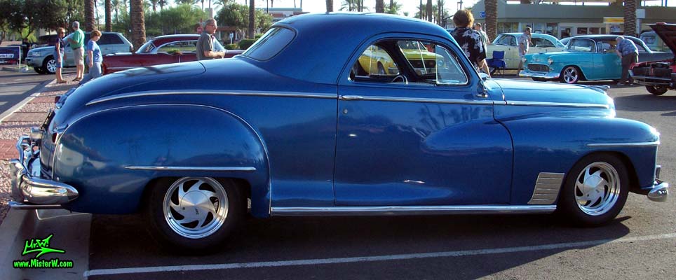 Photo of a blue metallic 1948 Dodge 3 Window Coupe at the Scottsdale Pavilions Classic Car Show in Arizona. 1948 Dodge 3 Window Coupe Passernger Side