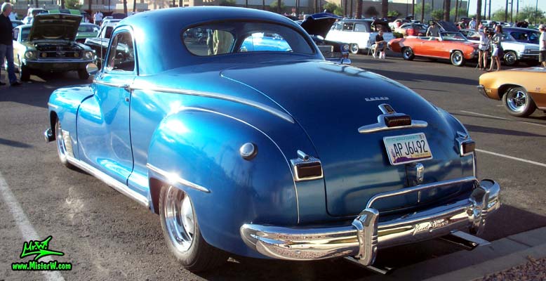 Photo of a blue metallic 1948 Dodge 3 Window Coupe at the Scottsdale Pavilions Classic Car Show in Arizona. Rearview of a 1948 Dodge 3 Window Coupe