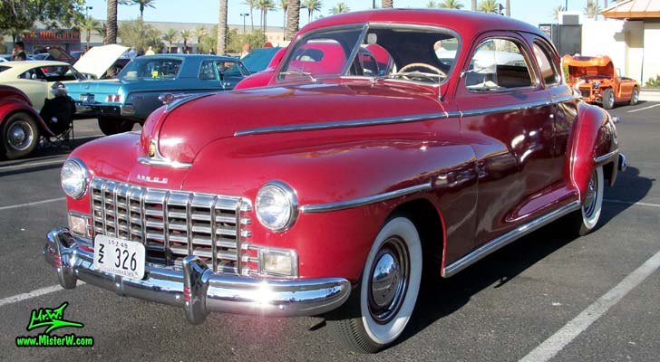 Photo of a red 1948 Dodge 5 Window Coupe at the Scottsdale Pavilions Classic Car Show in Arizona. 1948 Dodge 5 Window Coupe