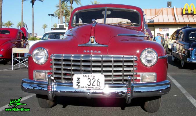 Photo of a red 1948 Dodge 5 Window Coupe at the Scottsdale Pavilions Classic Car Show in Arizona. Frontview of a 1948 Dodge 5 Window Coupe