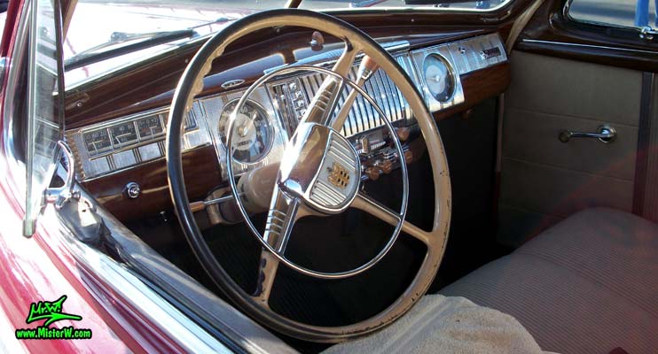 Photo of a red 1948 Dodge 5 Window Coupe at the Scottsdale Pavilions Classic Car Show in Arizona. 48 Dodge Dashbord