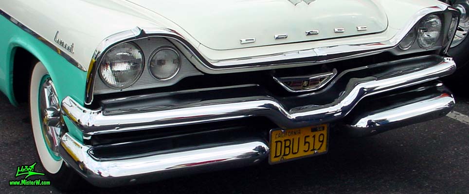 Photo of a white & turquoise 1957 Chrysler Dodge Coronet 2 Door Hardtop Coupe at the Scottsdale Pavilions Classic Car Show in Arizona. Chrome Grill & Front Bumper of a 57 Dodge