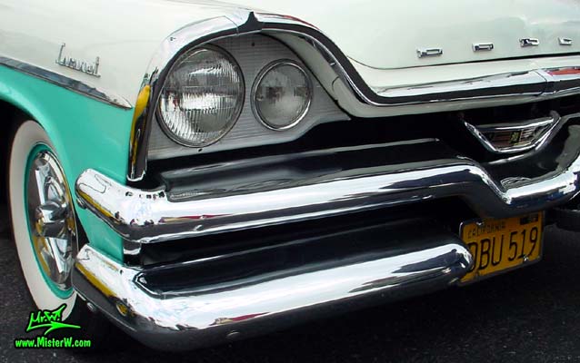 Photo of a white & turquoise 1957 Chrysler Dodge Coronet 2 Door Hardtop Coupe at the Scottsdale Pavilions Classic Car Show in Arizona. Head Light of a 57 Dodge Coronet