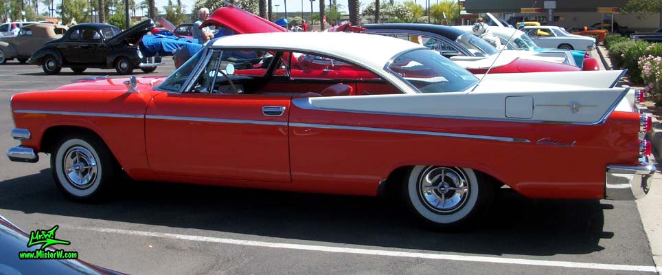 Photo of a red & white 1958 Chrysler Dodge Coronet 2 Door Hardtop Coupe at the Scottsdale Pavilions Classic Car Show in Arizona. Sideview of a 1958 Dodge Coronet Coupe
