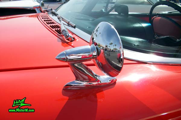 Photo of a red & white 1958 Chrysler Dodge Coronet 2 Door Hardtop Coupe at the Scottsdale Pavilions Classic Car Show in Arizona. Driverside Mirror of a 1958 Dodge Coronet Coupe