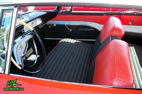 Photo of a red & white 1958 Chrysler Dodge Coronet 2 Door Hardtop Coupe at the Scottsdale Pavilions Classic Car Show in Arizona. Front Seats of a 1958 Dodge Coronet Coupe
