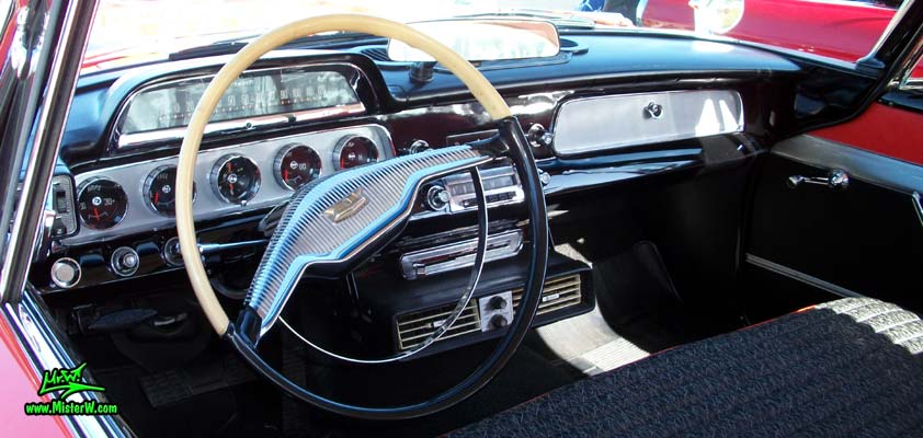 Photo of a red & white 1958 Chrysler Dodge Coronet 2 Door Hardtop Coupe at the Scottsdale Pavilions Classic Car Show in Arizona. Dashborad of a 1958 Dodge Coronet Coupe