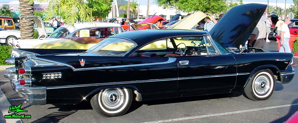 Photo of a black 1959 Chrysler Dodge Coronet 2 Door Hardtop Coupe at the Scottsdale Pavilions Classic Car Show in Arizona. Sideview of a 1959 Dodge Coronet Coupe