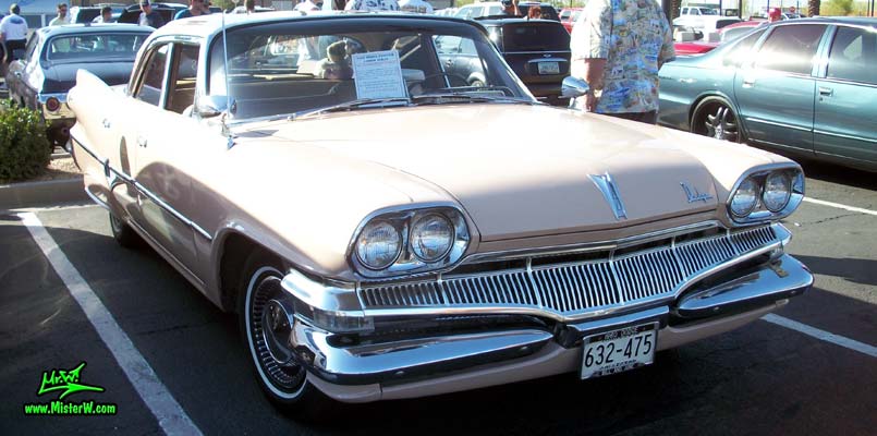 Photo of a pink 1960 Dodge Pioneer 4 door sedan at the Scottsdale Pavilions Classic Car Show in Arizona. 1960 Dodge