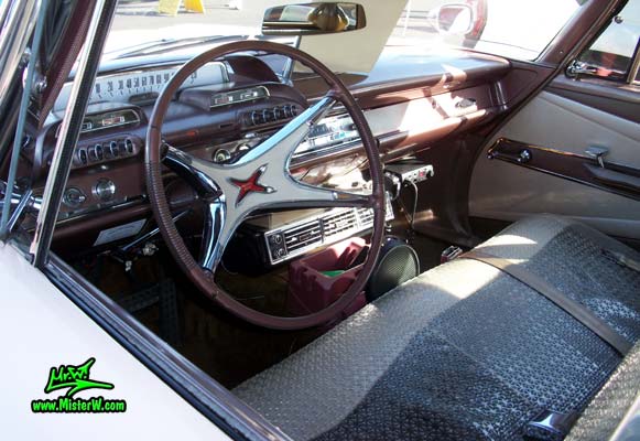 Photo of a pink 1960 Dodge Pioneer 4 door sedan at the Scottsdale Pavilions Classic Car Show in Arizona. Dash Board of a 1960 Dodge Pioneer sedan