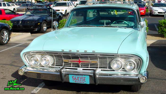 Photo of a turquoise 1961 Dodge Polara 4 door hardtop station wagen at the Scottsdale Pavilions Classic Car Show in Arizona. 1961 Dodge Polara front chrome grill & bumper