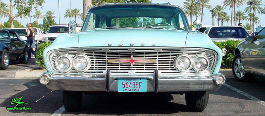 Photo of a turquoise 1961 Dodge Polara 4 door hardtop station wagen at the Scottsdale Pavilions Classic Car Show in Arizona. Frontview of a 1961 Dodge Polara station wagen