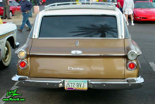 Photo of a brown 1962 Dodge Dart 4 door station wagen at the Scottsdale Pavilions Classic Car Show in Arizona. Rearview of a 1962 Dodge Dart station wagen