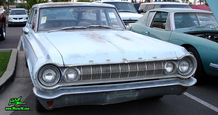 Photo of a bright blue 1964 Dodge 4 door station wagon at the Scottsdale Pavilions Classic Car Show in Arizona. 1964 Dodge front chrome grill & bumper