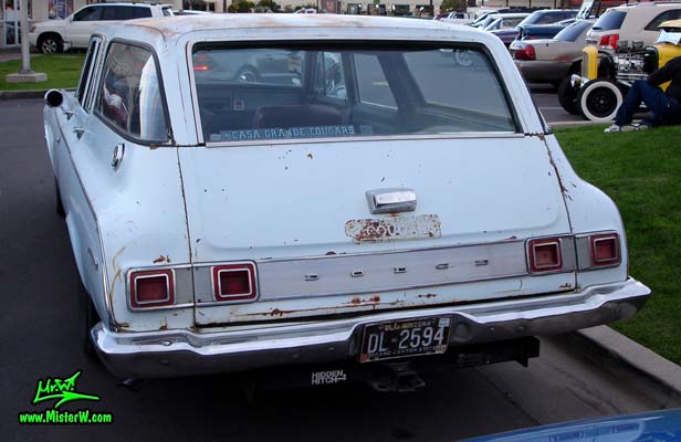 Photo of a bright blue 1964 Dodge 4 door station wagon at the Scottsdale Pavilions Classic Car Show in Arizona. Back of a 1964 Dodge stationwagon