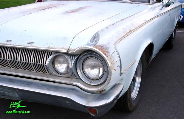 Photo of a bright blue 1964 Dodge 4 door station wagon at the Scottsdale Pavilions Classic Car Show in Arizona. 1964 Dodge station wagon head light & blinker