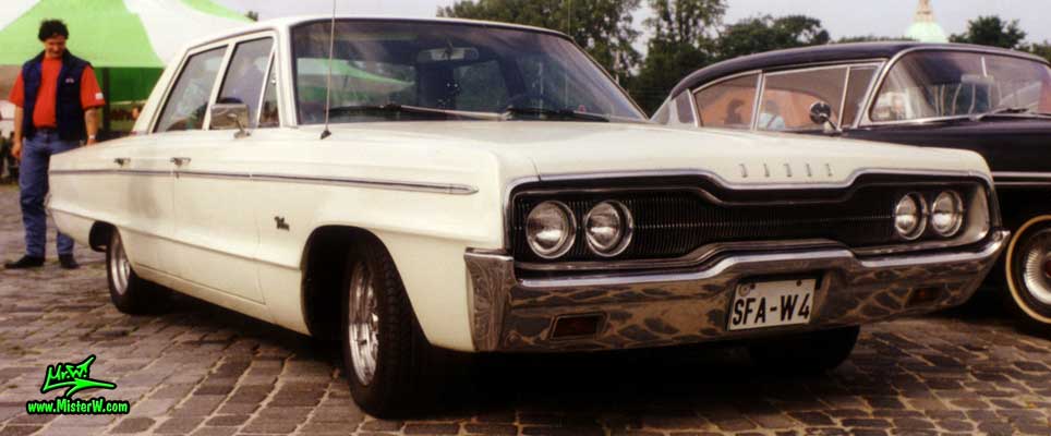 Photo of a white 1966 Dodge 4 Door Hardtop Sedan at a Classic Car Meeting in Germany. 1966 Dodge Chrome Grill