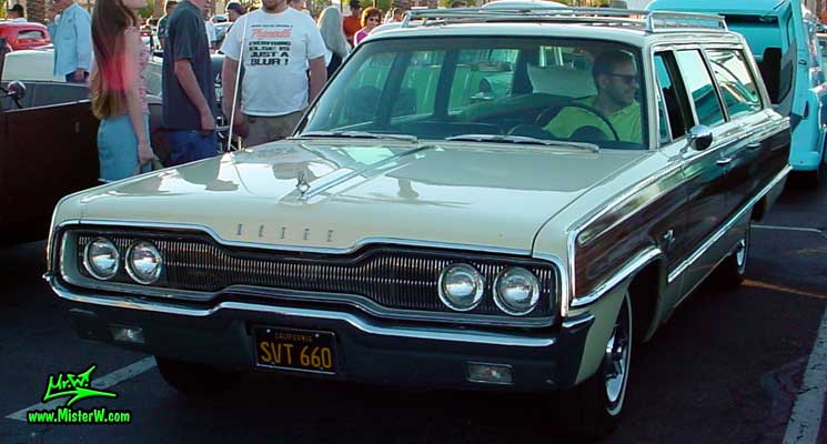 Photo of a white 1966 Dodge 4 Door Station Wagon at the Scottsdale Pavilions Classic Car Show in Arizona. 66 Dodge Wagon