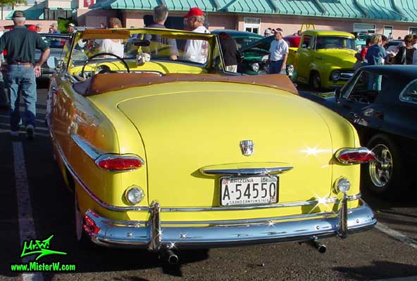 Photo of a yellow 1951 Ford Convertible at the Scottsdale Pavilions Classic Car Show in Arizona photo of a yellow 1951 Ford Convertible