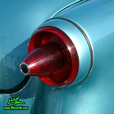 Photo of a blue metallic 1954 Ford Crestline Convertible at the Scottsdale Pavilions Classic Car Show in Arizona. 1954 Ford Crestline Tail Light