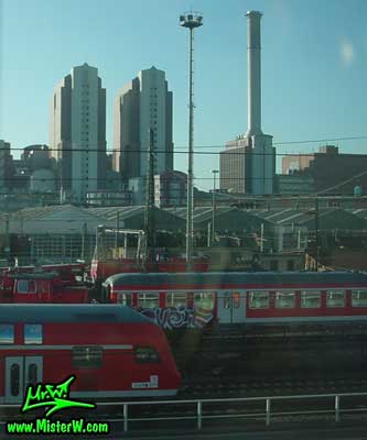 Photo of passenger Trains close to the Hauptbahnhof in downtown Frankfurt, taken from a ICE train (Intercity Express) in summer 2003 Train Graffiti Panel in Frankfurt am Main