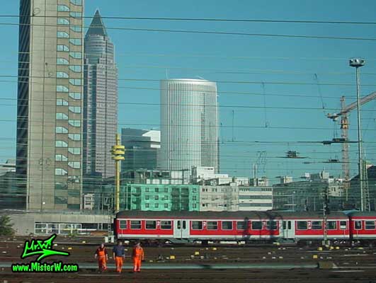 Photo of train workers in front of the MesseTurm in downtown Frankfurt, taken from a ICE train Train Workers in Downtown Frankfurt am Main