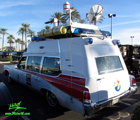Photo of a red & white Pontiac Ambulance turned into ECTO-AZ the Arizona Ghostbusters Ectomobile at the Scottsdale Pavilions Classic Car Show in Arizona. Arizona Ghostbuster Ectomobile ECTO-AZ Back & Ecto Antenna