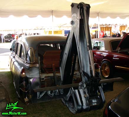 Photo of a black 1954 Cadillac Superior Funeral Coach at a classic car auction in Scottsdale, Arizona. Rearview of a 1954 Cadillac Superior