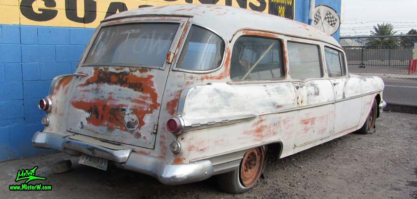 Photo of a faded grey 1956 Pontiac Memphian Ambulance in Phoenix, Arizona. Once painted red & white, in service for the Sheridan Willamina Fire Department in Oregon, build by the Memphian Coach Company in Memphis, Tennessee. Tail fins of a 1956 Pontiac Memphian Ambulance