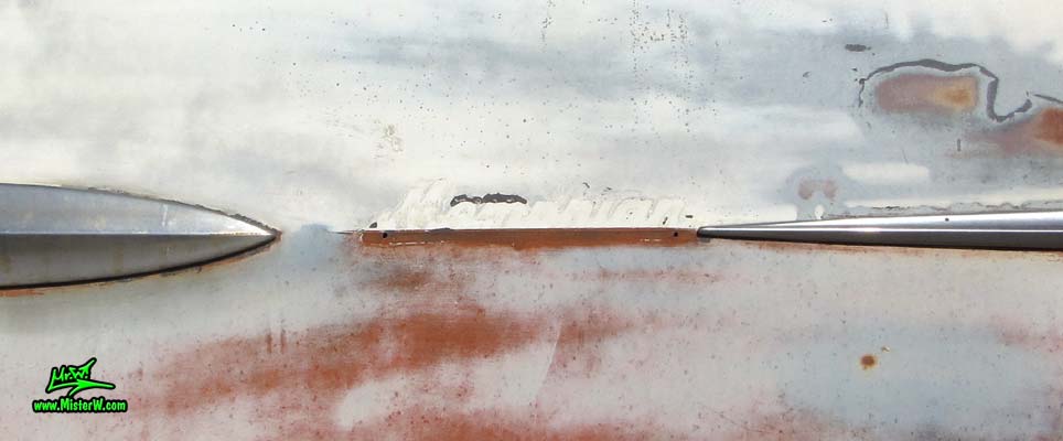 Photo of a faded grey 1956 Pontiac Memphian Ambulance in Phoenix, Arizona. Once painted red & white, in service for the Sheridan Willamina Fire Department in Oregon, build by the Memphian Coach Company in Memphis, Tennessee. Missing Memphian emblem of a 1956 Pontiac Memphian Ambulance
