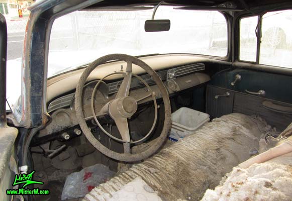Photo of a faded grey 1956 Pontiac Memphian Ambulance in Phoenix, Arizona. Once painted red & white, in service for the Sheridan Willamina Fire Department in Oregon, build by the Memphian Coach Company in Memphis, Tennessee. Dashboard of a 1956 Pontiac Memphian Ambulance