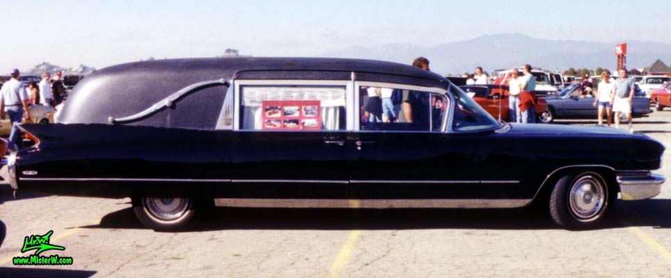 Photo of a black 1960 Cadillac Hearse at the Pomona Classic Car Swap Meet in Los Angeles, California. 60 Caddy Hearse Sideview