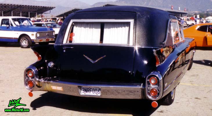 Photo of a black 1960 Cadillac Hearse at the Pomona Classic Car Swap Meet in Los Angeles, California. 60 Caddy Hearse Rearview