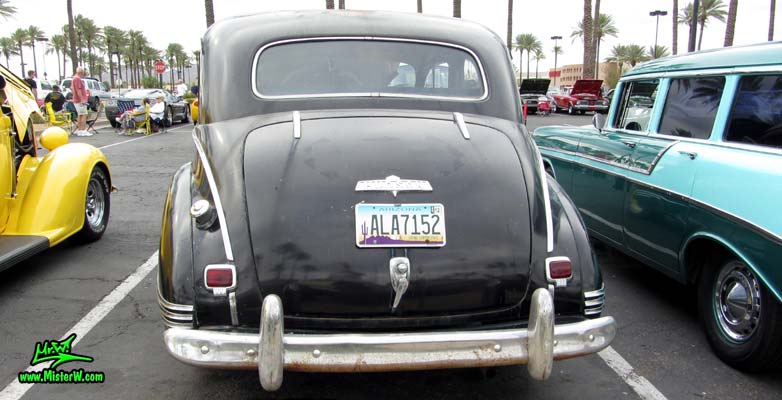 Photo of a black 1947 Hudson Super Six 4 Door Sedan at the Scottsdale Pavilions Classic Car Show in Arizona. Rearview of a 1947 Hudson Super Six