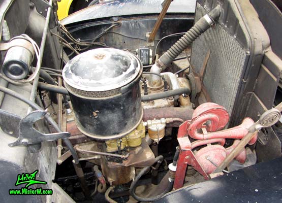 Photo of a black 1947 Hudson Super Six 4 Door Sedan at the Scottsdale Pavilions Classic Car Show in Arizona. Engine of a 1947 Hudson Super 6