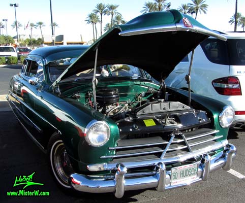 Photo of a green 1950 Hudson Super 6 Hardtop Coupe at the Scottsdale Pavilions Classic Car Show in Arizona. 1950 Hudson Super Six with open hood