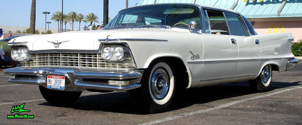Photo of a white 1957 Imperial 4 Door Hardtop Sedan at the Scottsdale Pavilions Classic Car Show in Arizona. 57 Imperial Sedan